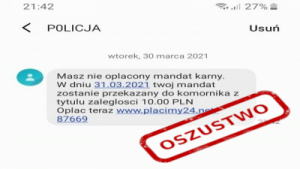 zrzut ekranu z SMS od oszustów, informujący o zaległości w opłacie mandatu karnego