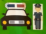 obrazek przedstawiający policjanta i radiowóz policyjny