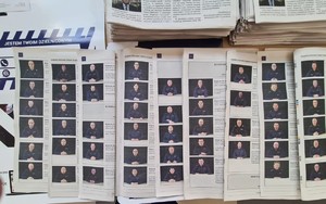 zdjęcie przedstawia otwartą gazetą na której znajdują się zdjęcia policjantów